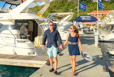 Couple walking along a doc